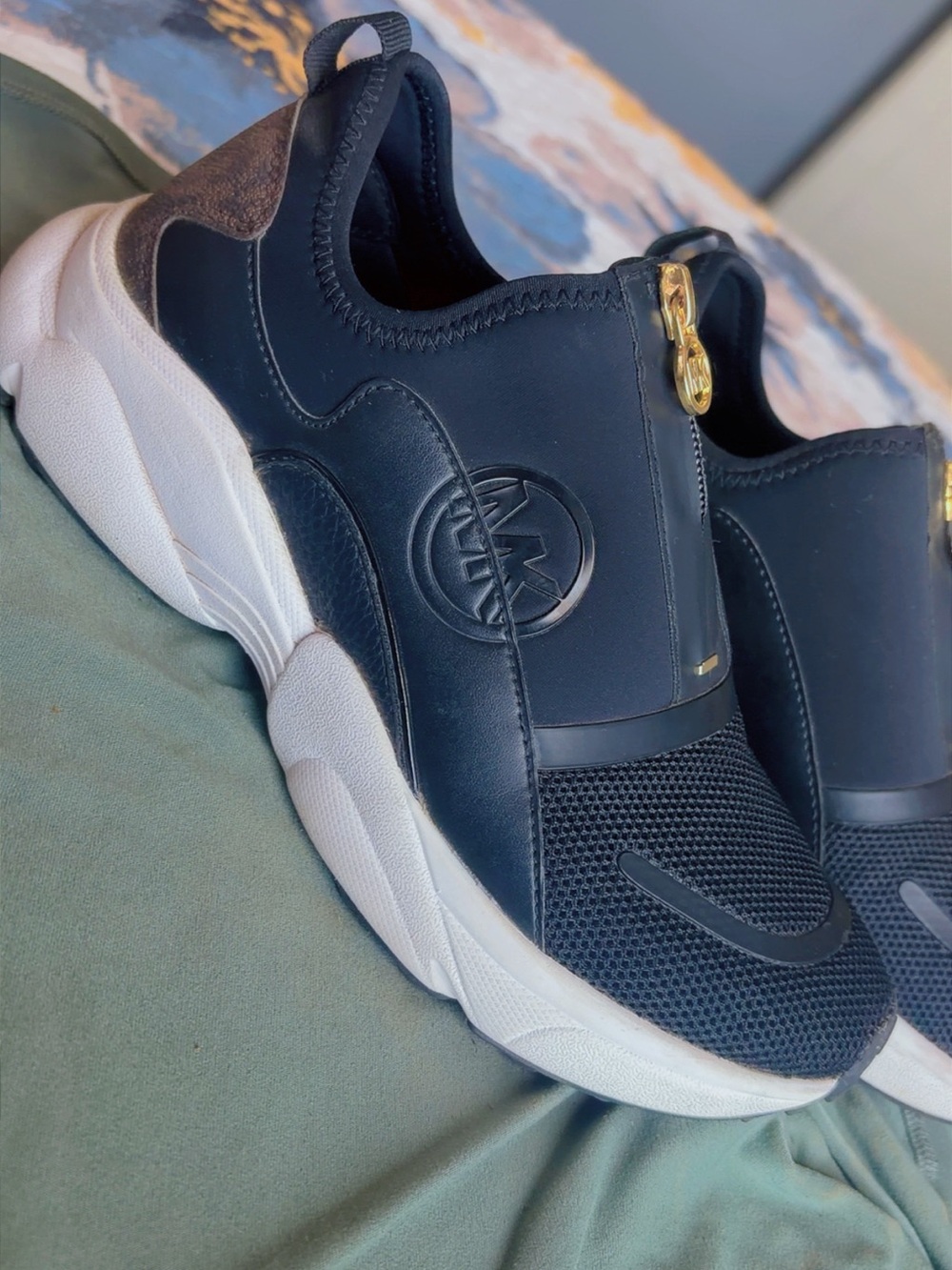 Michael Kors Black and White Slip-On Logo Sneakers with Gold Accent